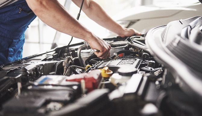 Man servicing car