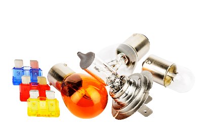 Car bulbs and coloured fuses arranged together.