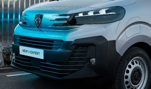 Close-up of a Peugeot New E-Expert van with visible front grille and logo.