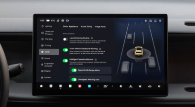 Car dashboard screen displaying driver assistance features.