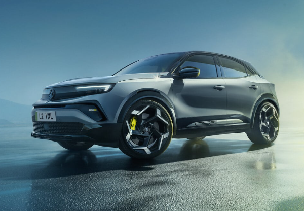 Silver SUV with modern design, visible front and side view, on a wet surface.