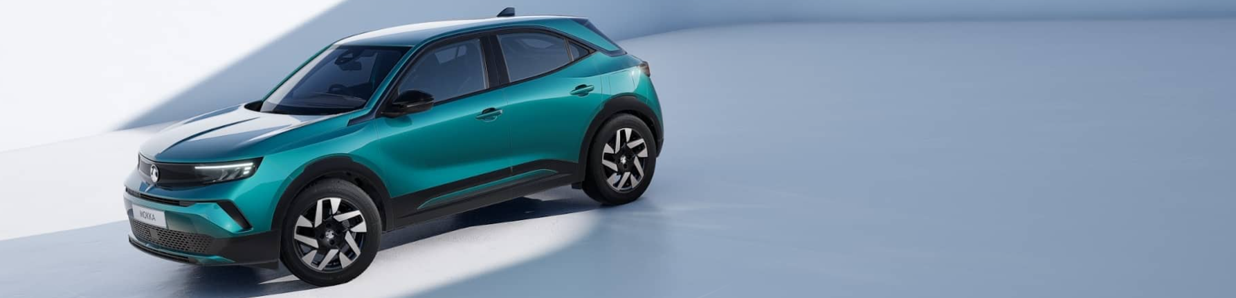 vauxhall mokka in blue from the side